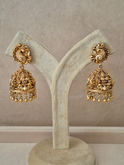 Traditional gold-toned festive earrings featuring clustered white seed pearls and delicate hanging pearl accent  by naitri.in