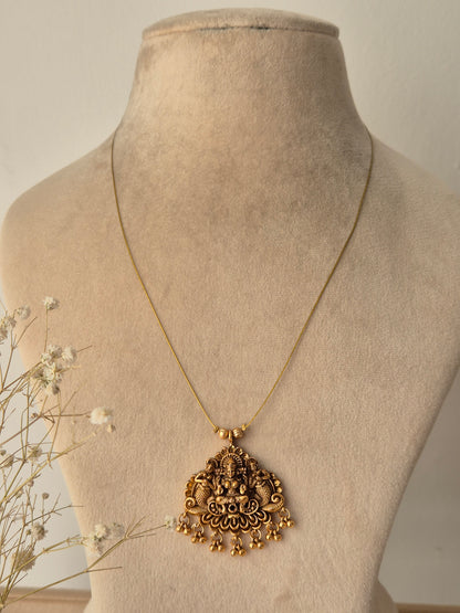 Gold necklace with invisible chain, goddess motifs handcrafted designed, small golden beads hanging down from the pendant by naitri.in