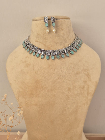 Necklace Set – handcrafted oxidized silver-plated necklace with turquoise stones and matching earrings by Naitri.in