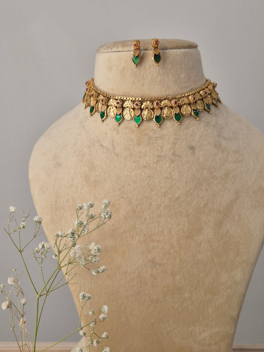 Handcrafted Julie Choker Set featuring a gold-polished brass necklace with green emerald-style stone drops and matching stud earrings by naitri.in