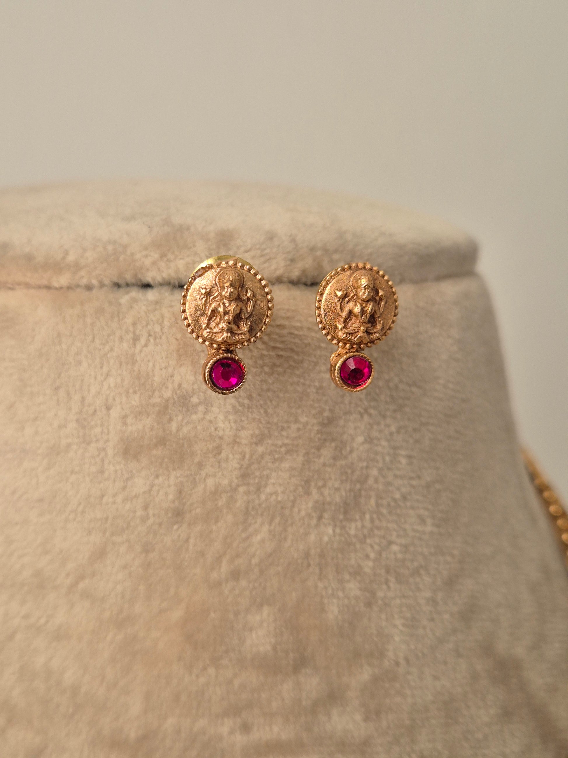 Gold earrings with red gemstones ocuses on wealth and abundance by naitri.in