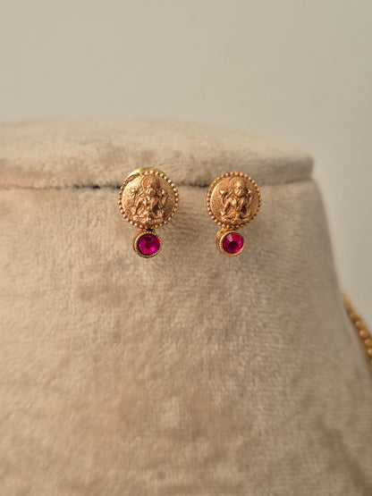 Gold earrings with red gemstones ocuses on wealth and abundance by naitri.in