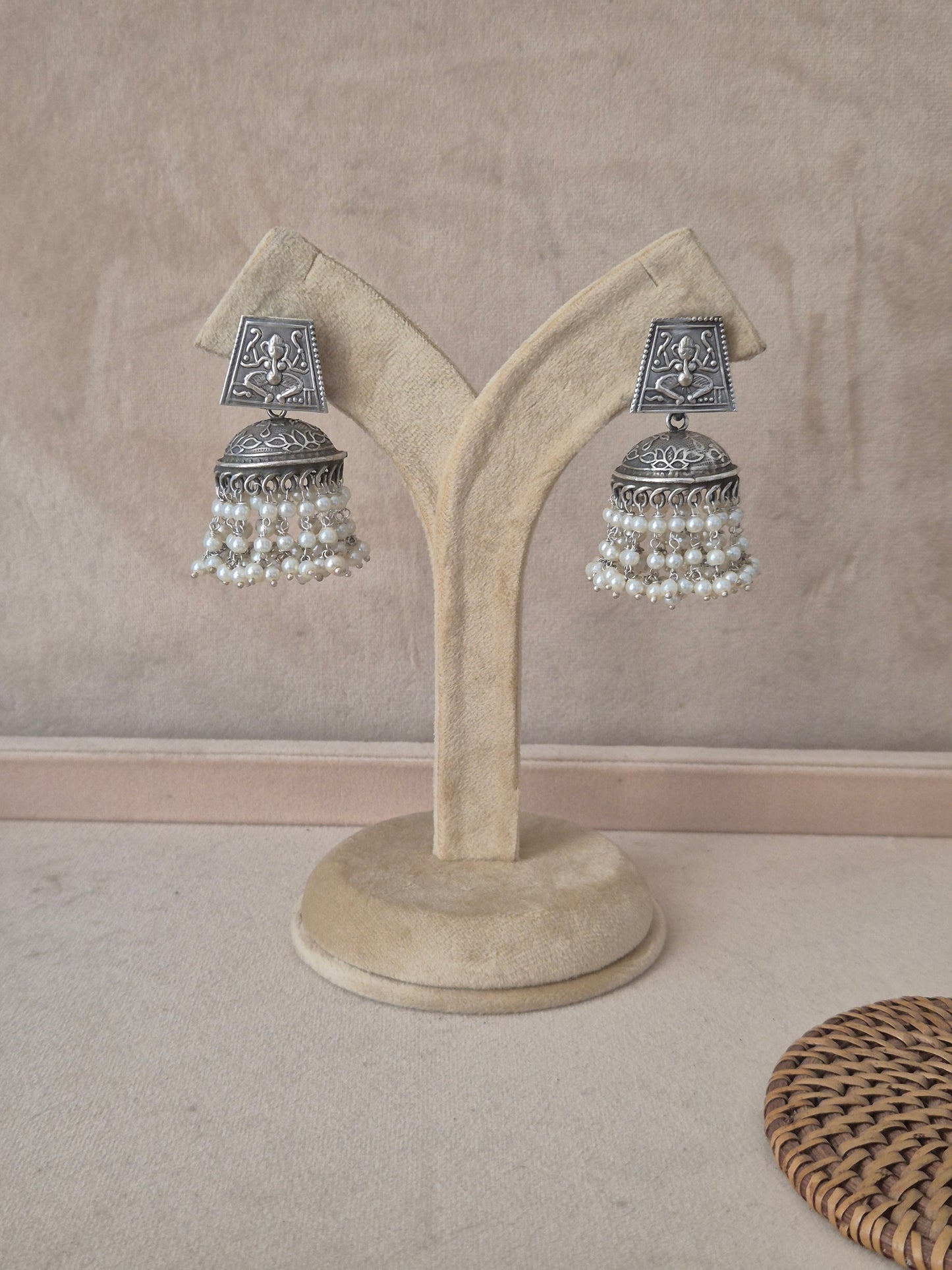 Pair of Kalpana silver oxidized jhumka earrings featuring square engraved studs and tiered pearl dangles by naitri.in