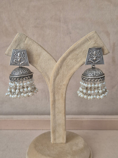Naitri premium Kalpana oxidized silver jhumka earrings with pearls from the Silver Jewellery collection. Handcrafted silver-toned traditional jhumka earrings featuring clusters of delicate white pearl beads by naitri.in