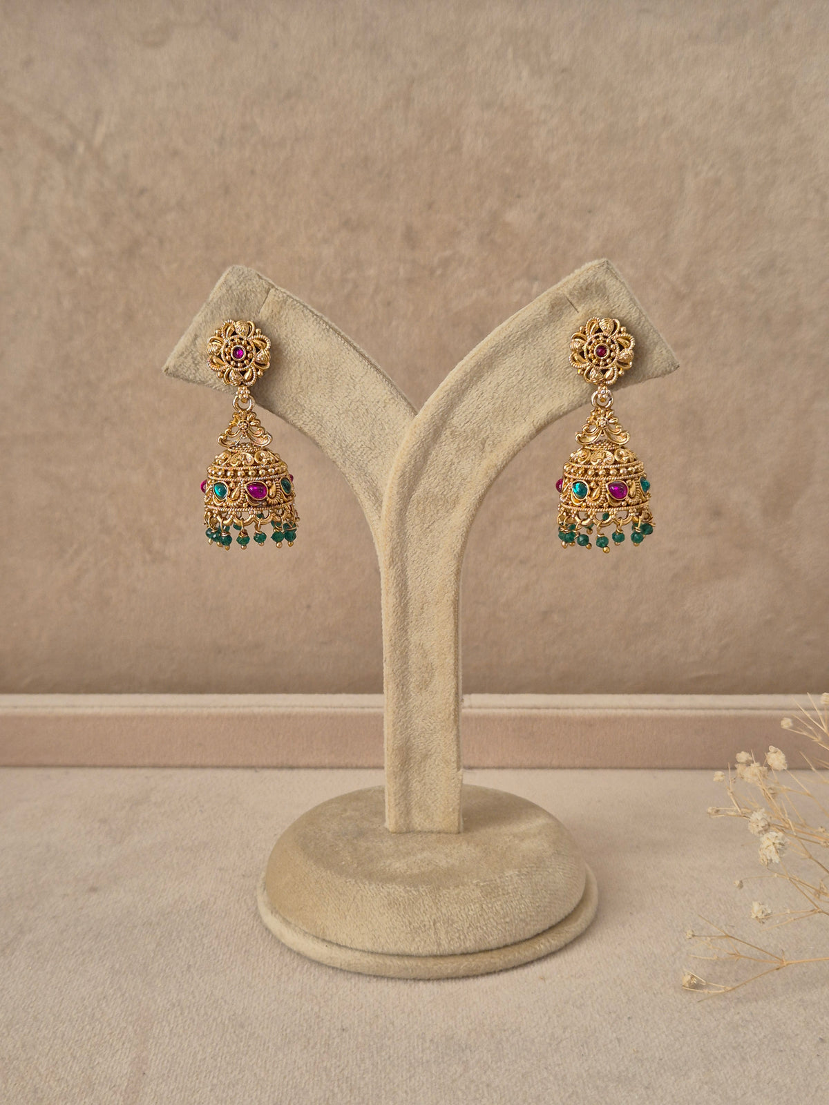 Kanchan handcrafted gold-finish jhumka earrings with ruby and green stone accents by naitri.in