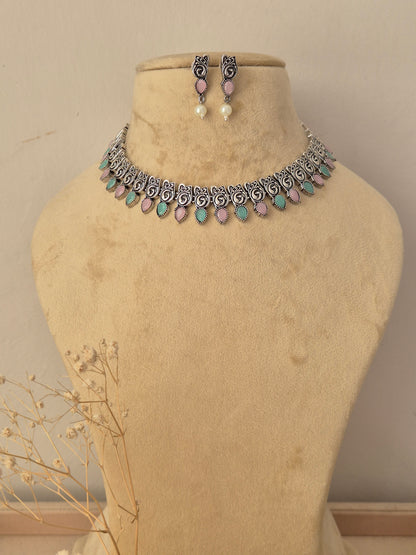 Kashmira silver oxidized choker necklace with light blue stone accents and matching pearl drop earrings by naitri
