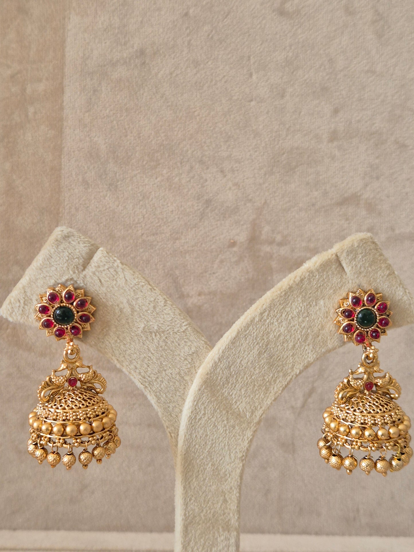 Traditional Indian style Earrings in brass alloy with a polished golden finish and bead detailing by naitri.in