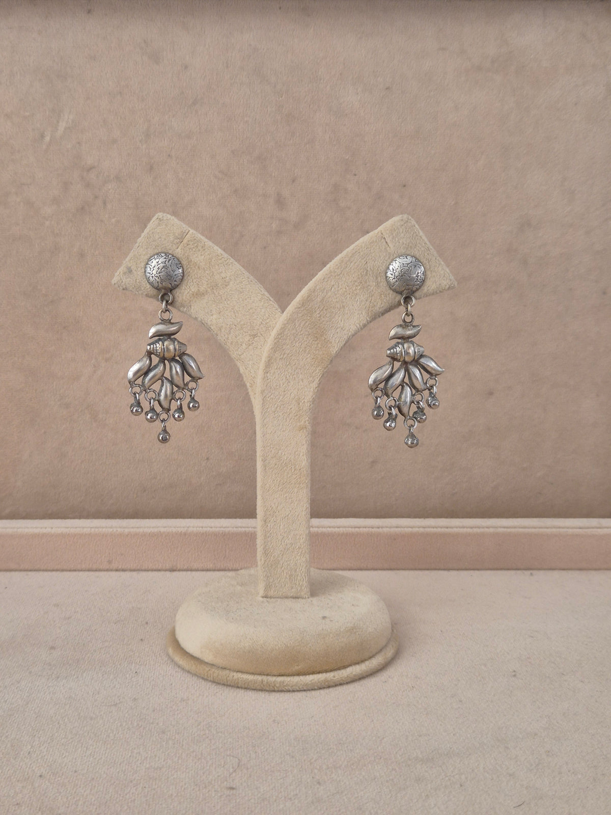 Kaya oxidized silver dangle earrings with intricate leaf motifs and bead drops by naitri.in
