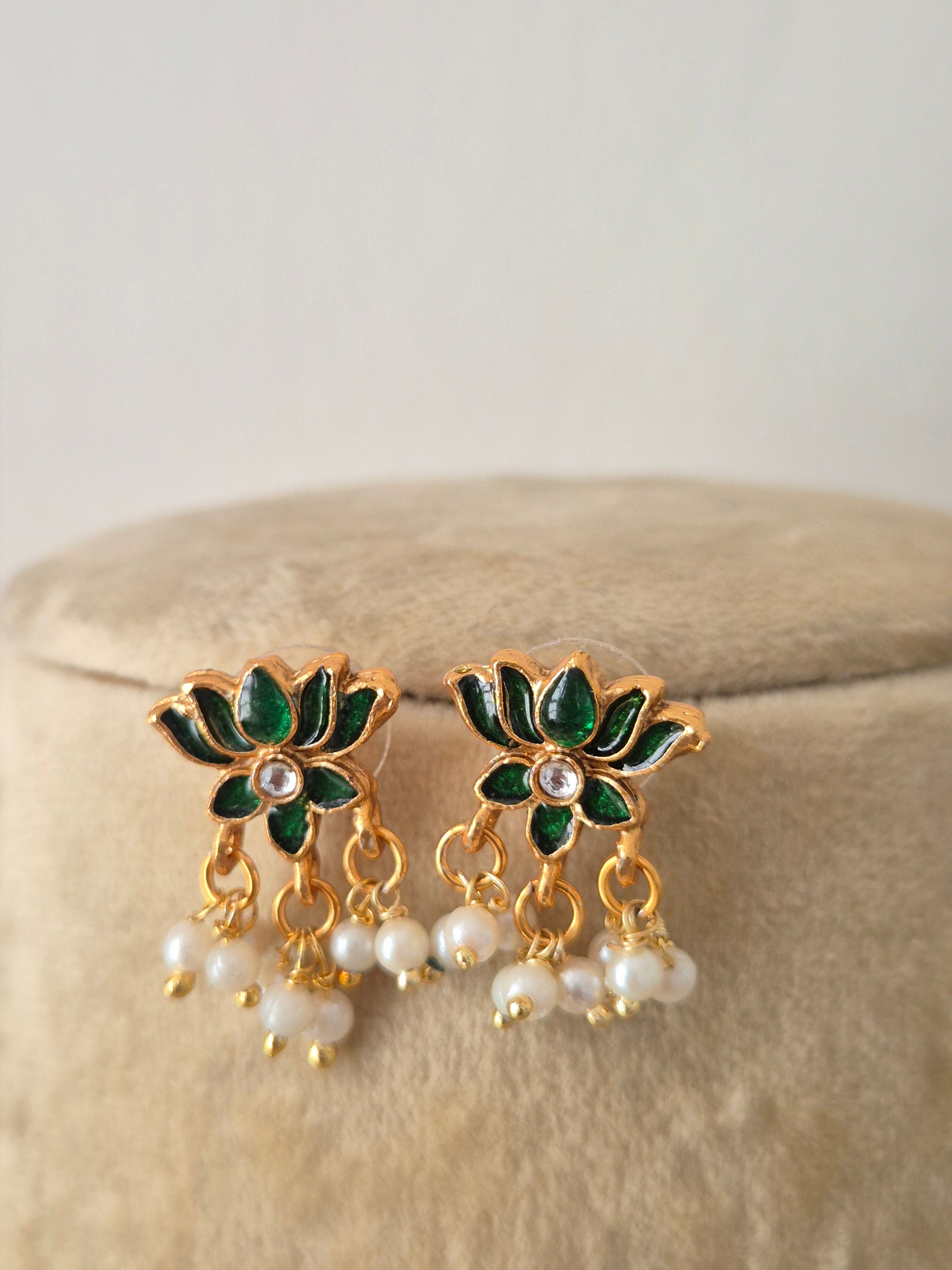 Antique intricate green lotus-shaped accents and hanging pearl clusters earrings by naitri.in
