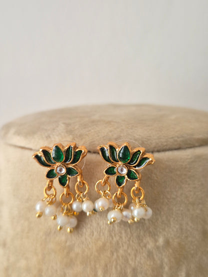Antique intricate green lotus-shaped accents and hanging pearl clusters earrings by naitri.in