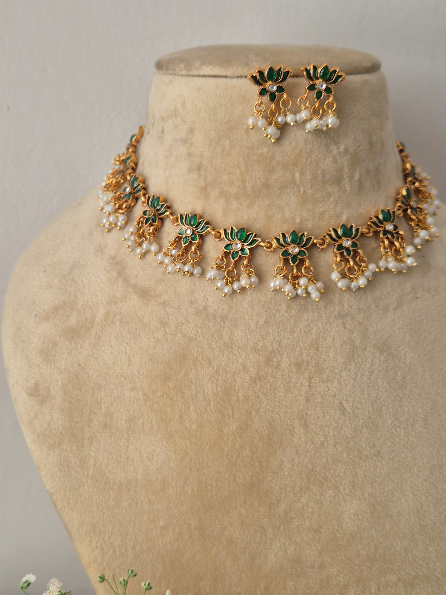 Traditional Indian style golden brass alloy choker necklace and earring set from the NAITRI collection by naitri.in
