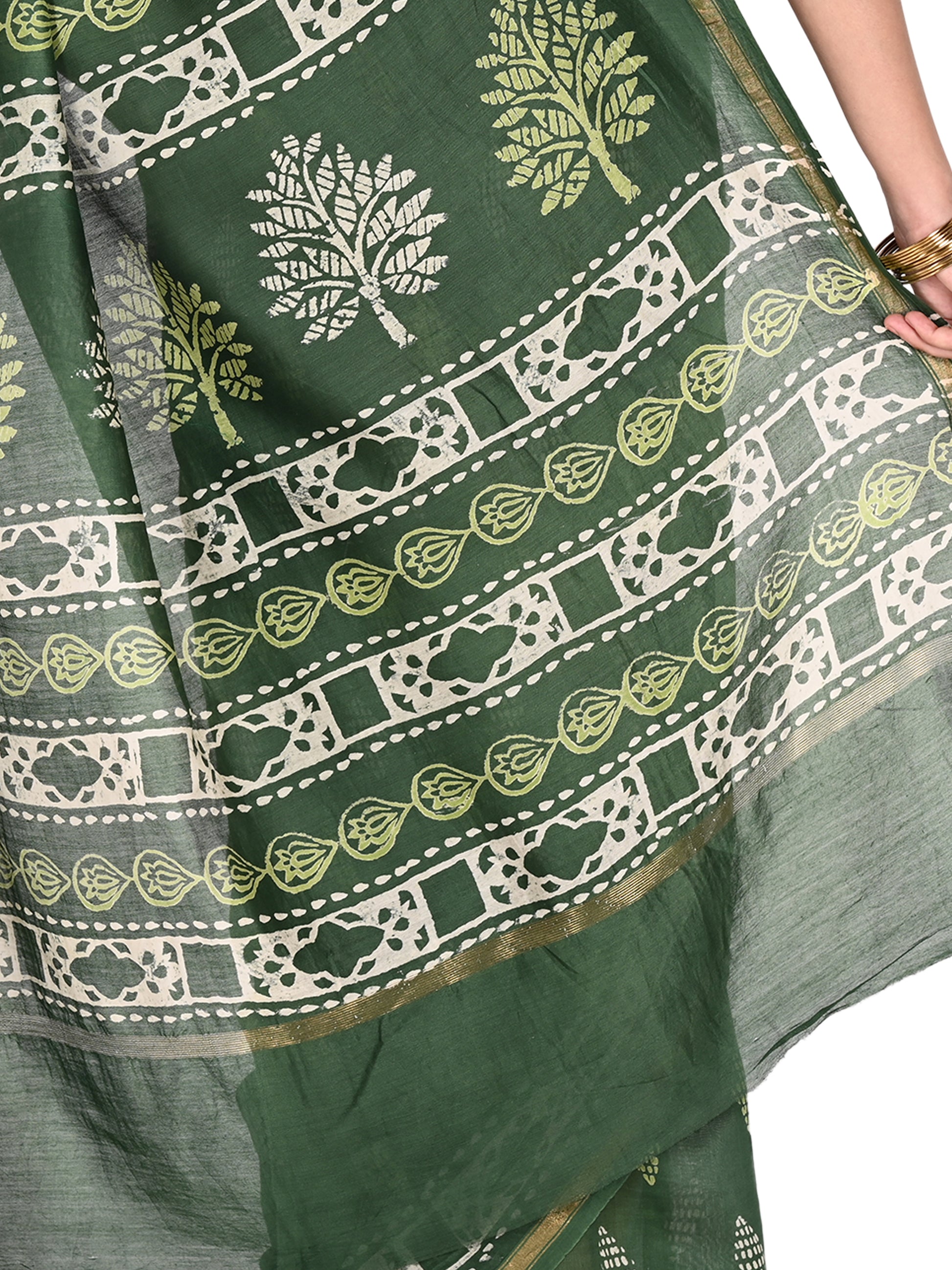 Close-up view of the Kimaya saree showing the intricate white hand-block printed tree designs against a rich forest green cotton-silk fabric with a subtle sheen pallu by naitri.in
