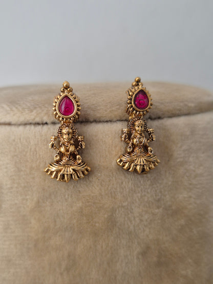 Antique gold-plated earring featuring delicate dangling pendants with tiny red  stone accents, by naitri.in