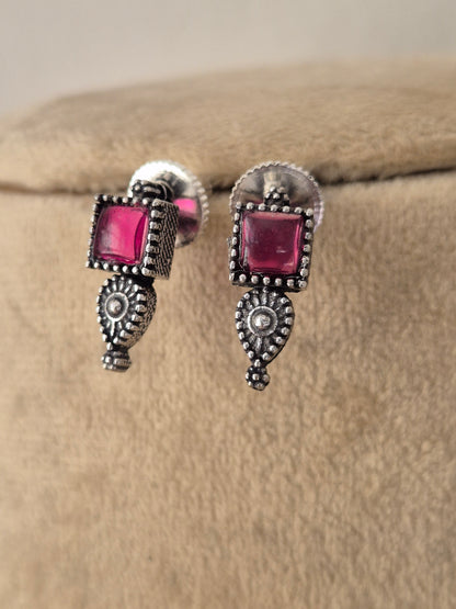 Kokila oxidized silzer earrings with ruby pink stones by naitri.in