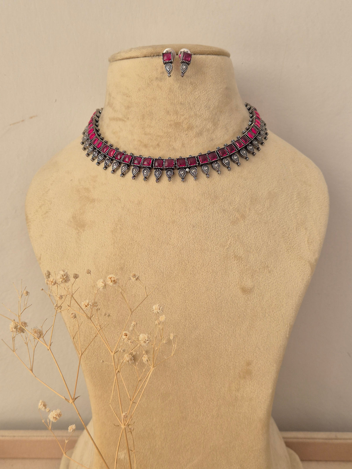 Kokila oxidized silver choker necklace set with ruby pink stones and matching earrings by naitri.in