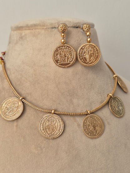 Vintage-style coin necklace with a double-sided embossed Radha-Krishna  motif, hanging from a delicate gold cable chain by naitri.in