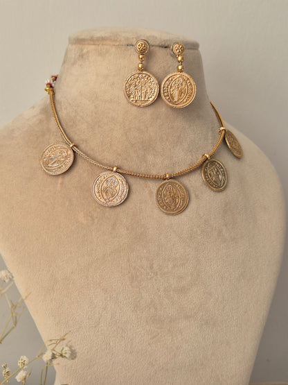 temple jewelry coin necklace with matte gold finish, featuring Radha-Krishna coins and a large matching pendants at the center by naitri.in