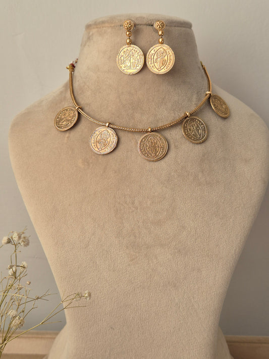 Minimalist brushed gold coin necklace with a subtle  Radha-Krishna and a high-polish finish by naitri.in