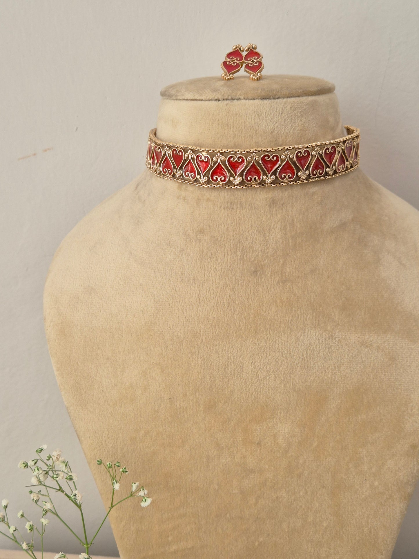 Elegant red and gold-toned traditional choker jewelry set, Naitri gold-plated Latika choker and earring set with red enamel detailing by naitri.in