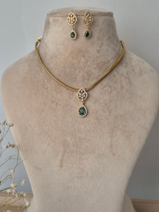 Gold necklace with green gemstones golden chain by naitri.in