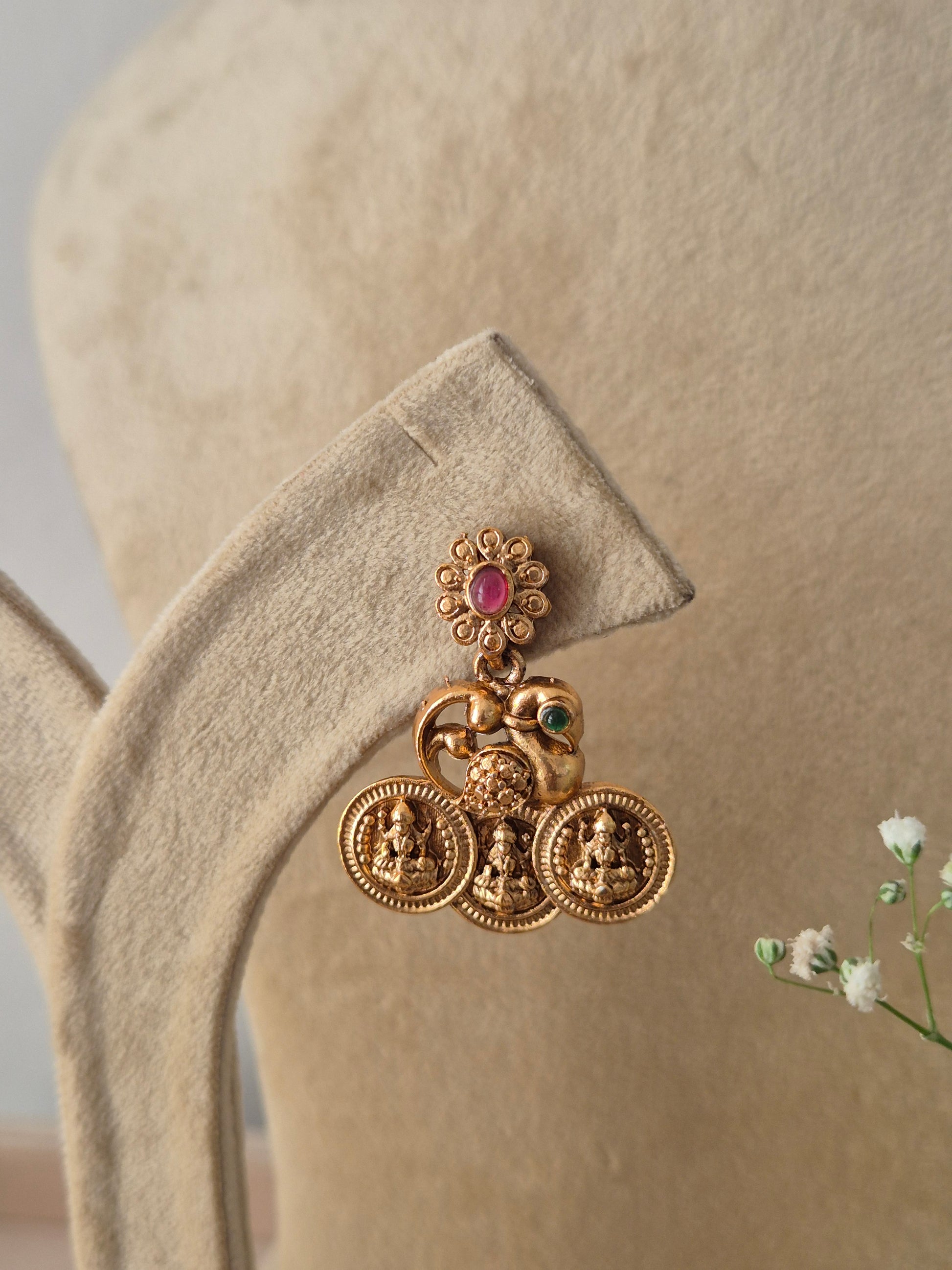 golden brass alloy coin earring with matching traditional earrings decorated with a small pinkish-red stone by naitri.in