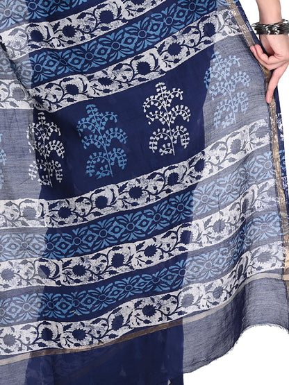 Full-length view of the Manjita saree in a deep navy blue cotton-silk blend, showcasing the intricate white artisanal block prints and shimmering gold zari border pallu by naitri.in