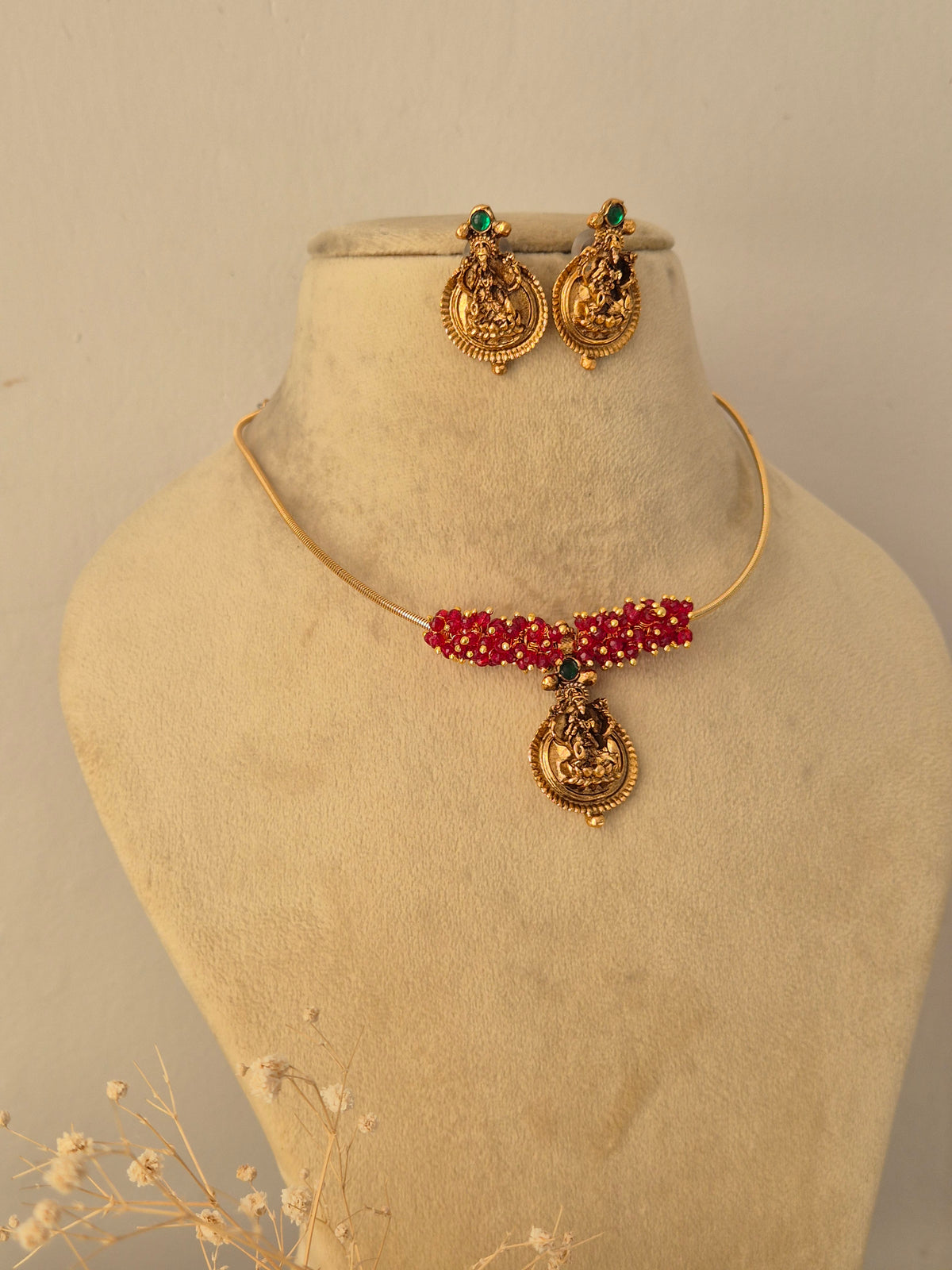 Close-up of a traditional Indian necklace set featuring colorful stone by Naitri.in