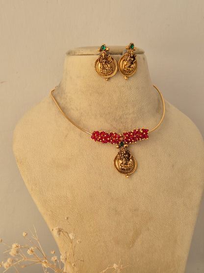 Close-up of a traditional Indian necklace set featuring colorful stone by Naitri.in