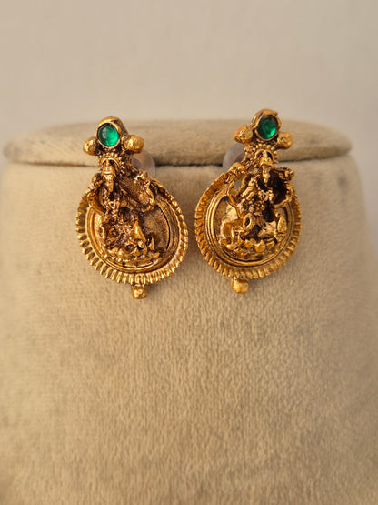 Ornate gold-toned fashion jewelry set with a detailed pendant and matching earrings for ethnic wear by Naitri.in
