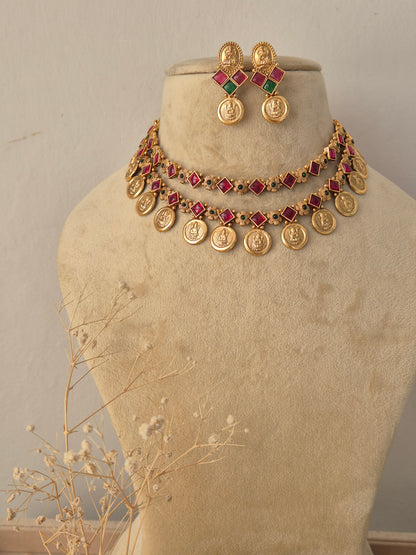 Traditional Indian ethnic gold necklace and earring set with gemstone details by Naitri.in