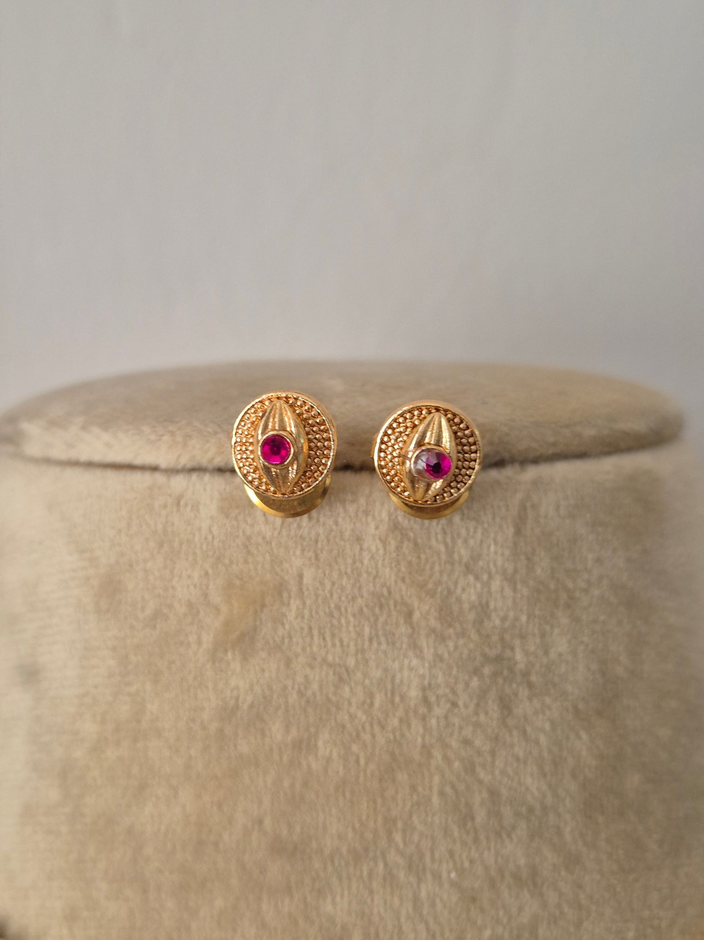 Antique gold-plated ethnic delicate dangling circular medallions with ruby-pink stone accents by naitri.in