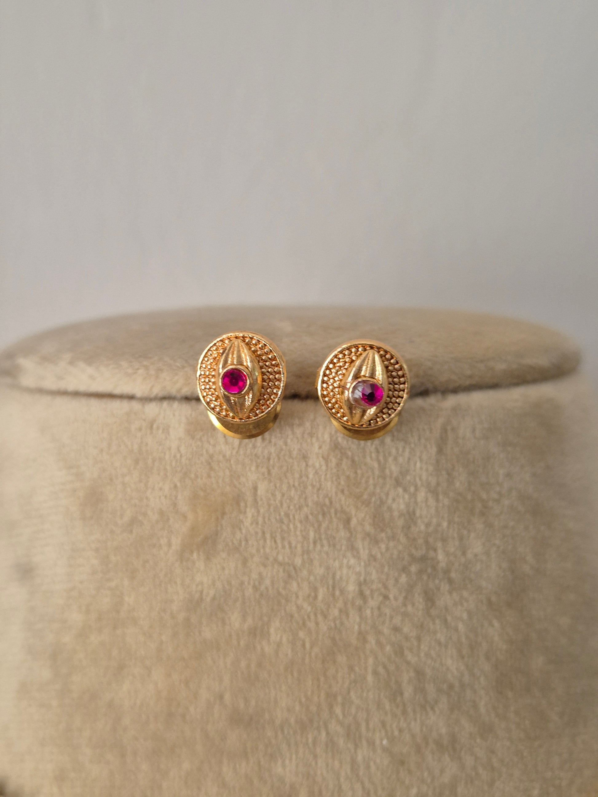 Antique gold-plated ethnic delicate dangling circular medallions with ruby-pink stone accents by naitri.in