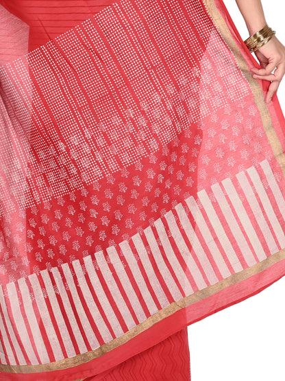 Close-up of a red cotton-silk blend saree with traditional white Bagh hand-block prints and a shimmering gold border, showcasing the fluid drape and texture pallu by naitri.in
