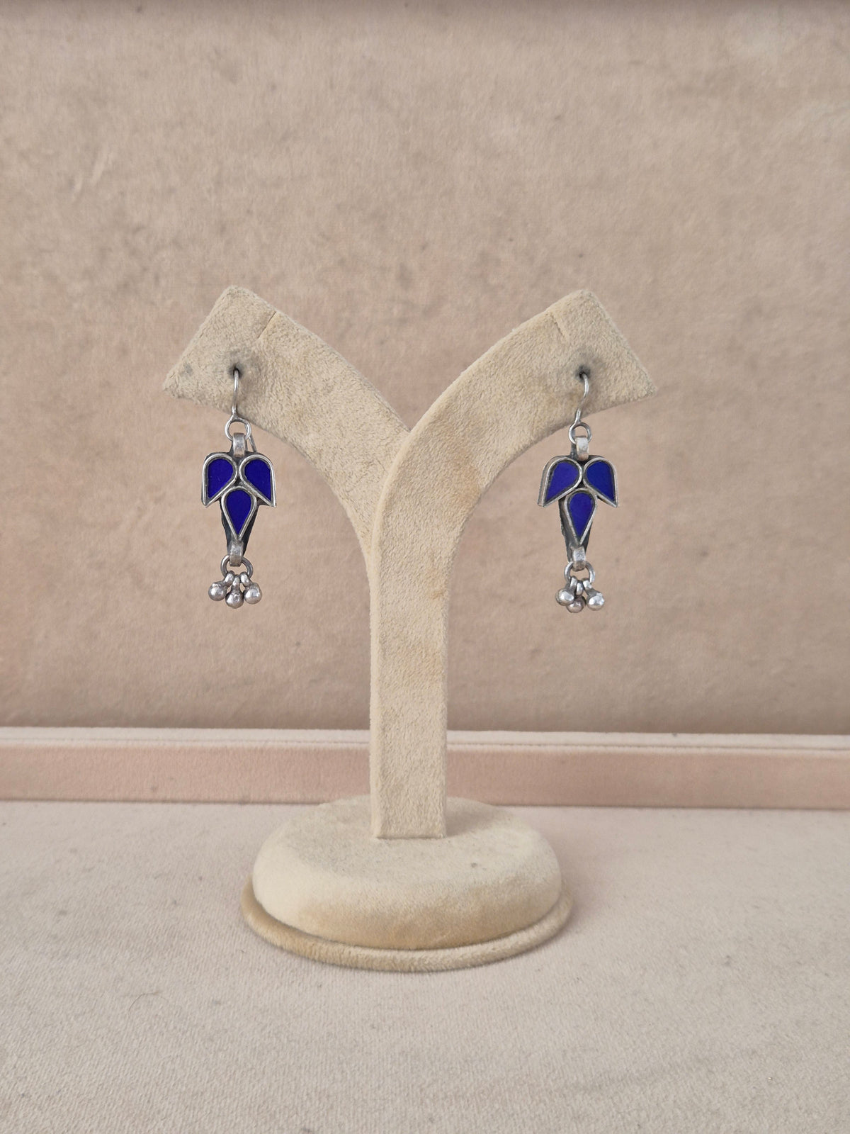Glass Earrings featuring handcrafted blue glass in a leaf design with small silver beads by naitri.in