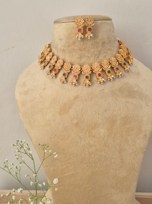 Antique gold choker necklace with dangling colorful stone pendants and matching earrings by naitri.in