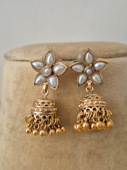Artisanal earring set in a modern Indian ethnic aesthetic, jhumka earrings with white stones and pearl cluster fringes by naitri.in
