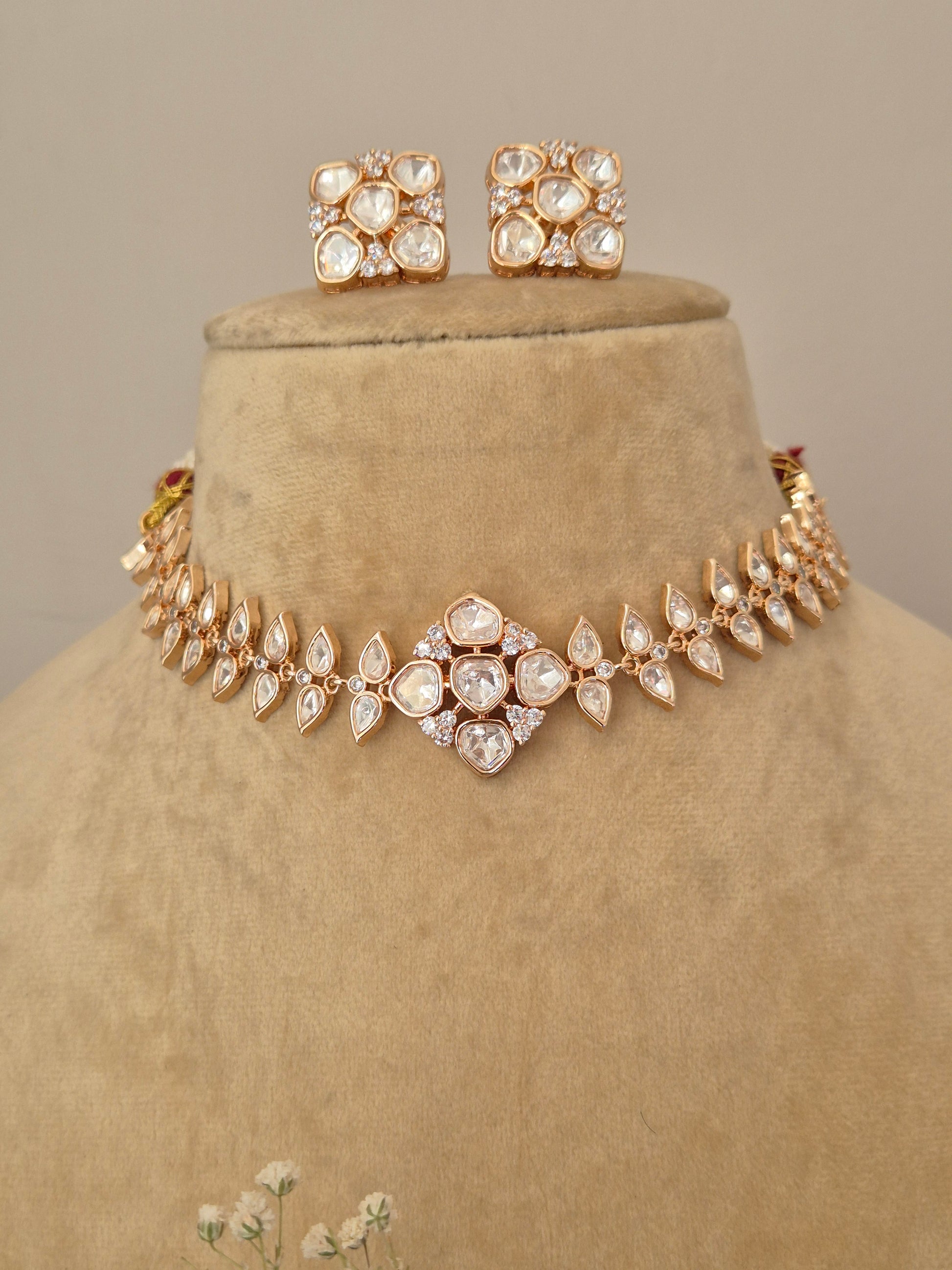 Modern Indian festive jewelry: Hazel American Diamond necklace set in rose gold, perfect for pairing with sarees and lehengas by naitri.in