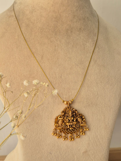 Modern Indian aesthetic necklace with a handcrafted Laxmi pendant and polished gold-tone finish by naitri.in