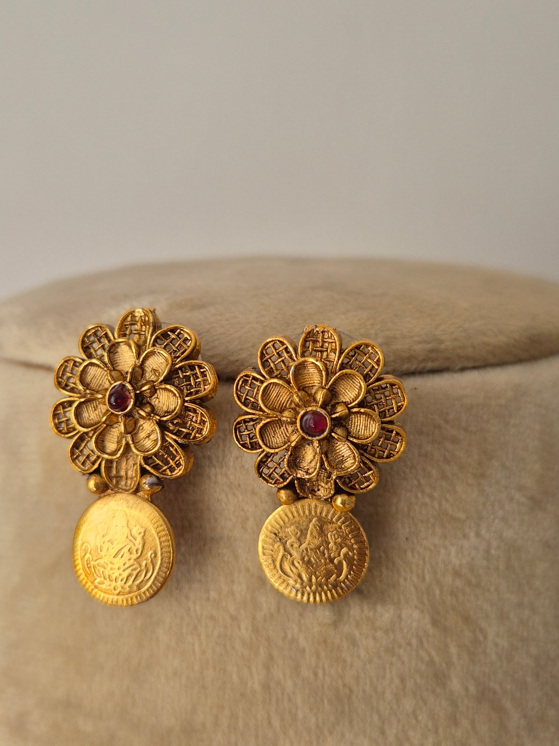 gold coin with textured floral earring showcasing an antique finish from the Naitri.in
