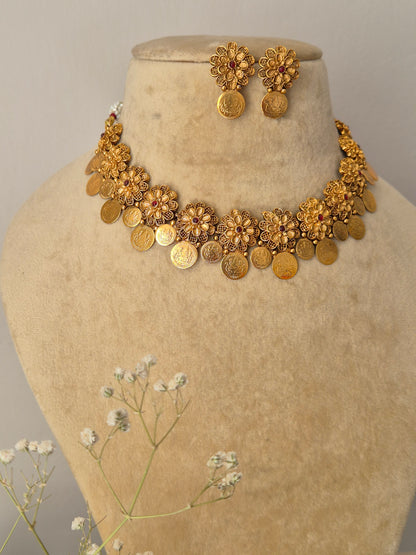 old-plated floral choker with dangling coin accents and coordinating festive stud earrings by naitri.in