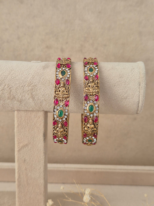 Set of 2 gold-plated bangles featuring a textured geometric grid pattern by naitri.in