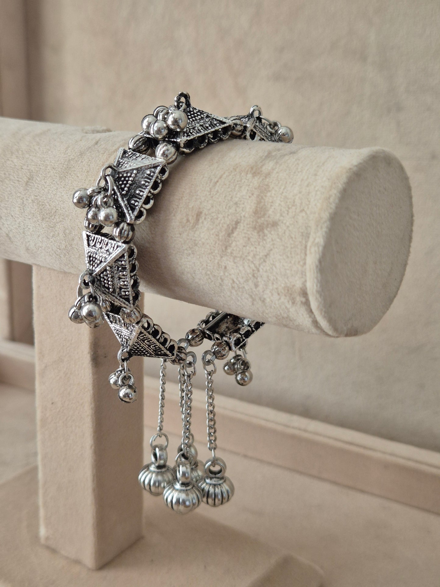 Close-up of Naitri Alaknanda premium oxidized silver bracelet showcasing traditional Indian tribal craftsmanship with a vintage, antique finish by naitri.in