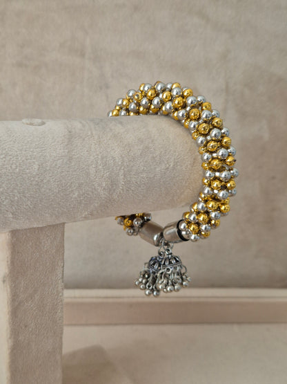 Close-up of Naitri Amukta premium mixed-metal ethnic bracelet showcasing traditional Indian beadwork craftsmanship with a vintage ghungroo style finish by naitri.in