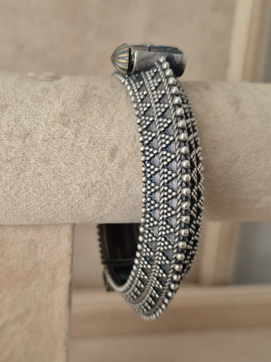 Close-up of Naitri Ashoki premium silver oxidized bangle bracelet featuring traditional Indian style metalwork engraving by naitri.in