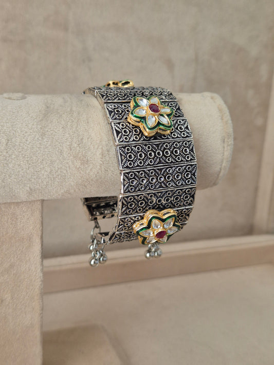 Close-up of Naitri Bharti premium oxidized silver cuff bracelet showcasing traditional Indian tribal craftsmanship with an antique, vintage finish by naitri.in