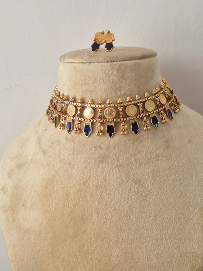 Modern Indian ethnic imitation jewelry set including a golden brass alloy choker necklace with geometric blue stone drops by naitri.in