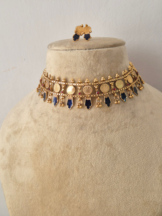 Modern Indian ethnic imitation jewelry set including a golden brass alloy choker necklace with geometric blue stone drops by naitri.in