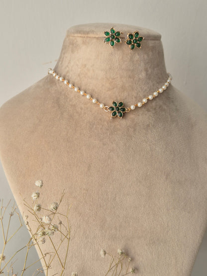 Naitri Chakori Choker Set featuring white pearls and green floral stone work by naitri.in