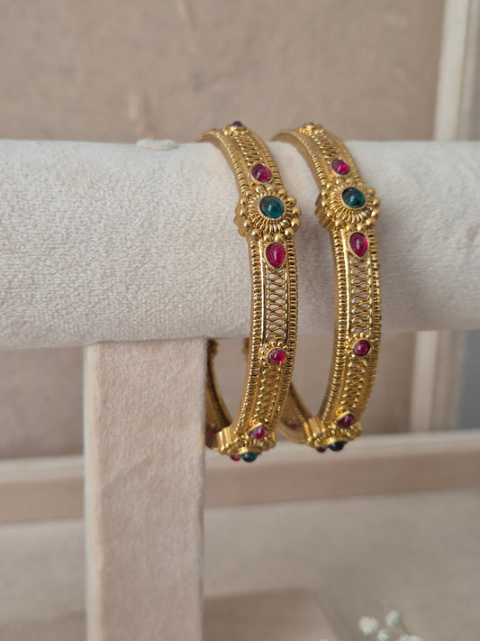 Dhruvi Bangles set of 2, traditional Indian gold-plated bangles with red and green stones, ethnic festive and bridal jewelry collection by Naitri.in