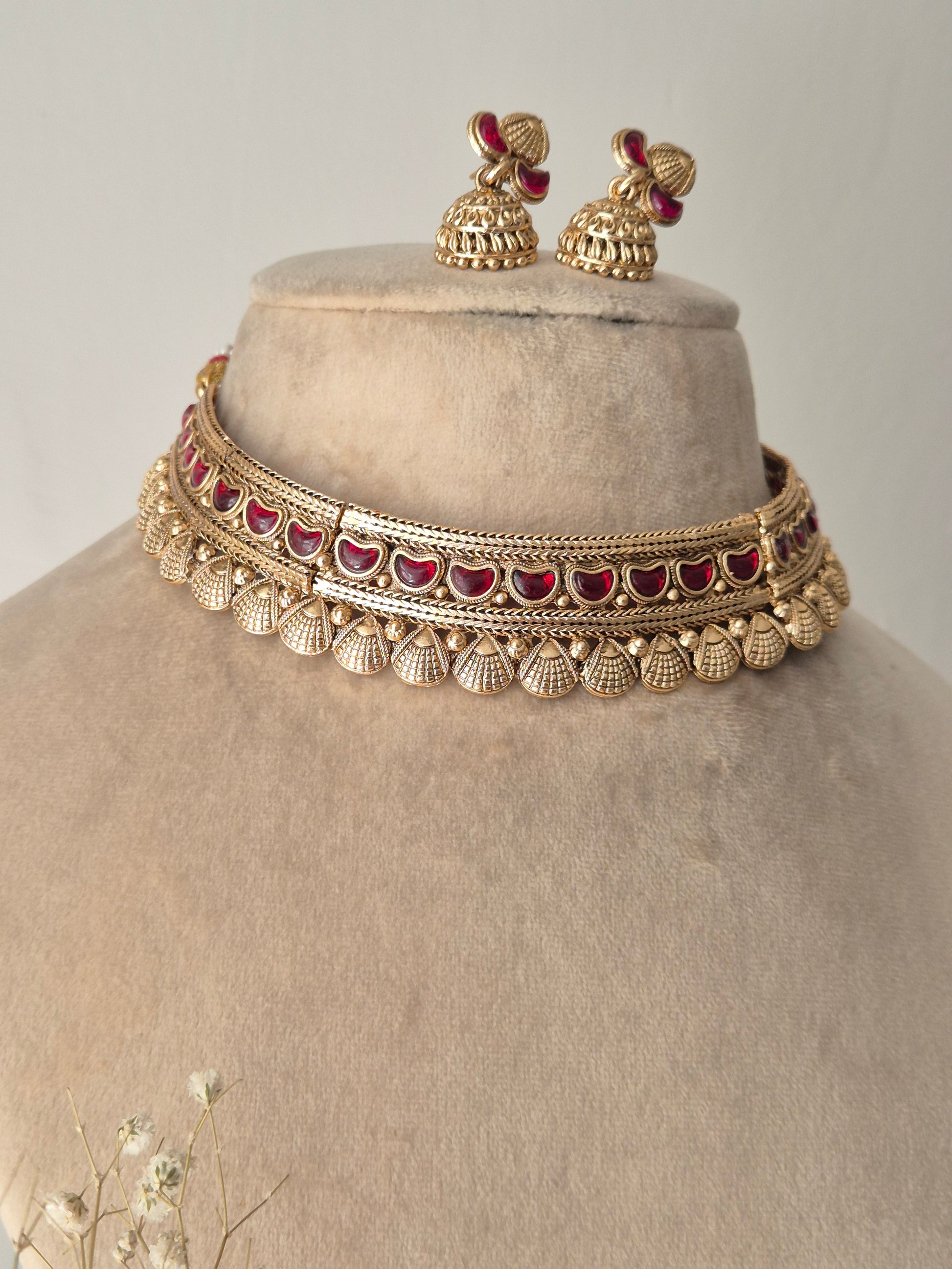 Heavy bridal gold choker set with adjustable dori closure and grand matching jhumki earrings by naitri.in
